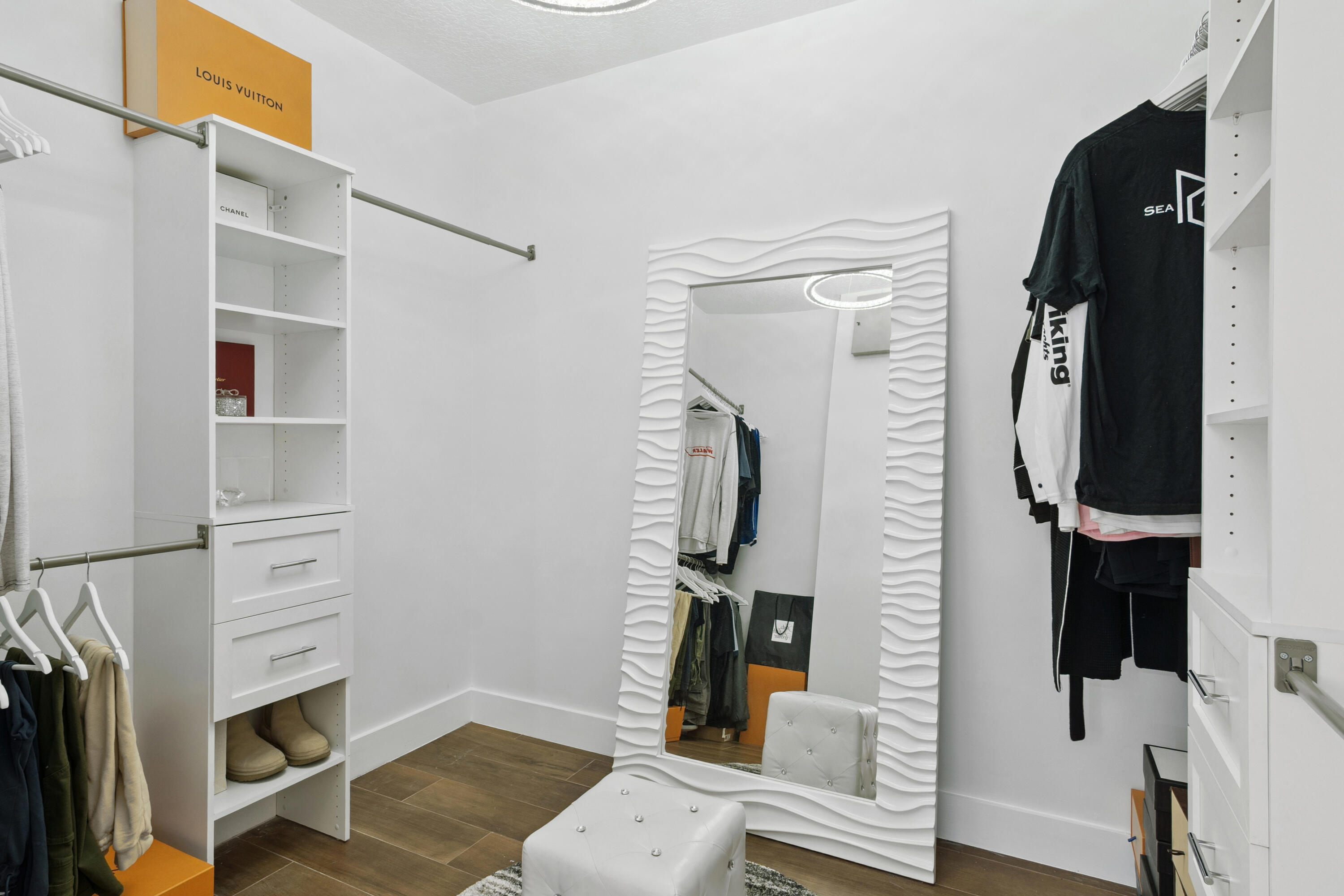7110 Northwest Turtle Walk Boca Raton, FL 33487 - Photo 14 of 36 a view of walk in closet with clothes and shoes