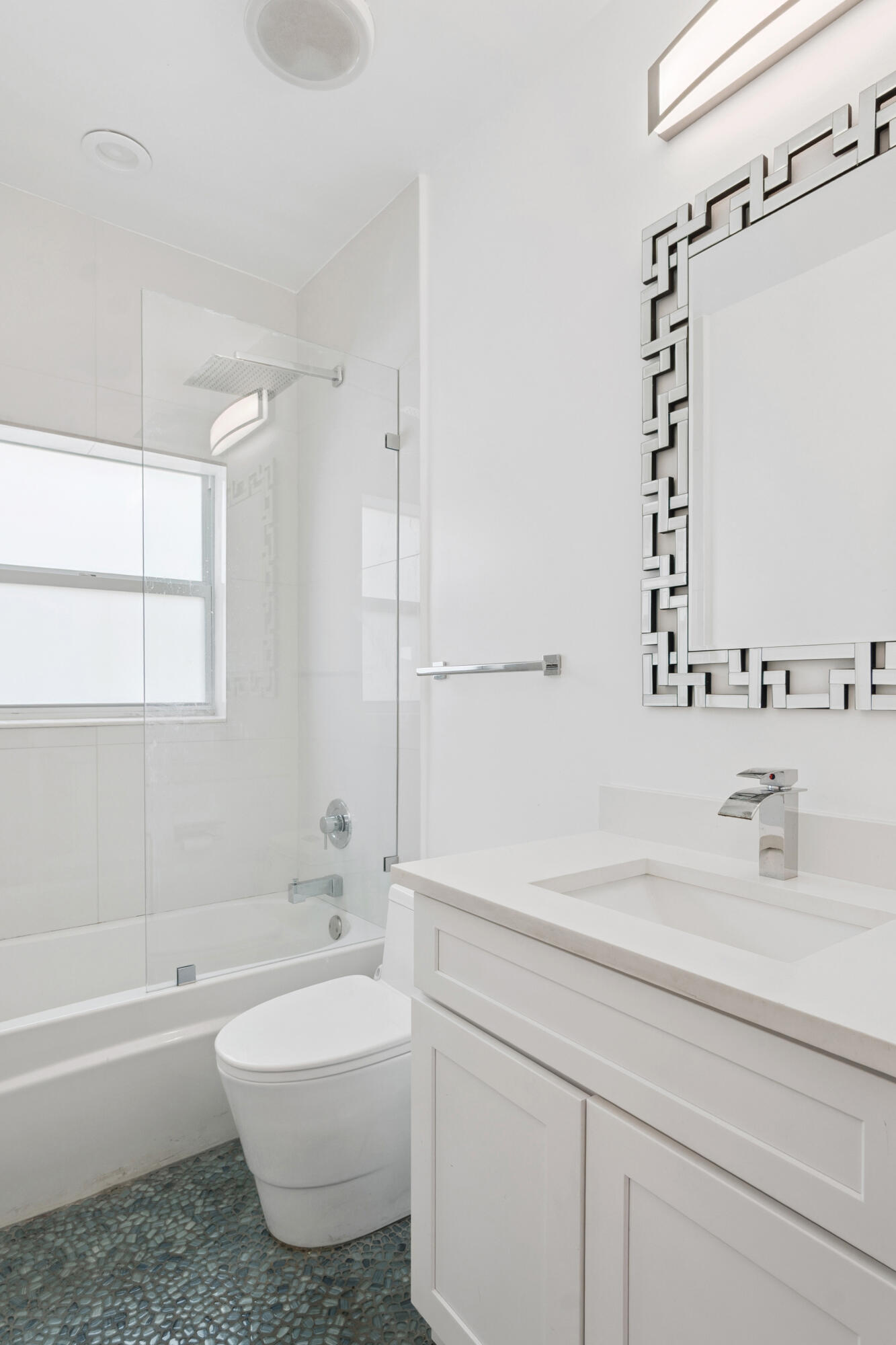 7110 Northwest Turtle Walk Boca Raton, FL 33487 - Photo 17 of 36 a bathroom with a bathtub a sink and a mirror