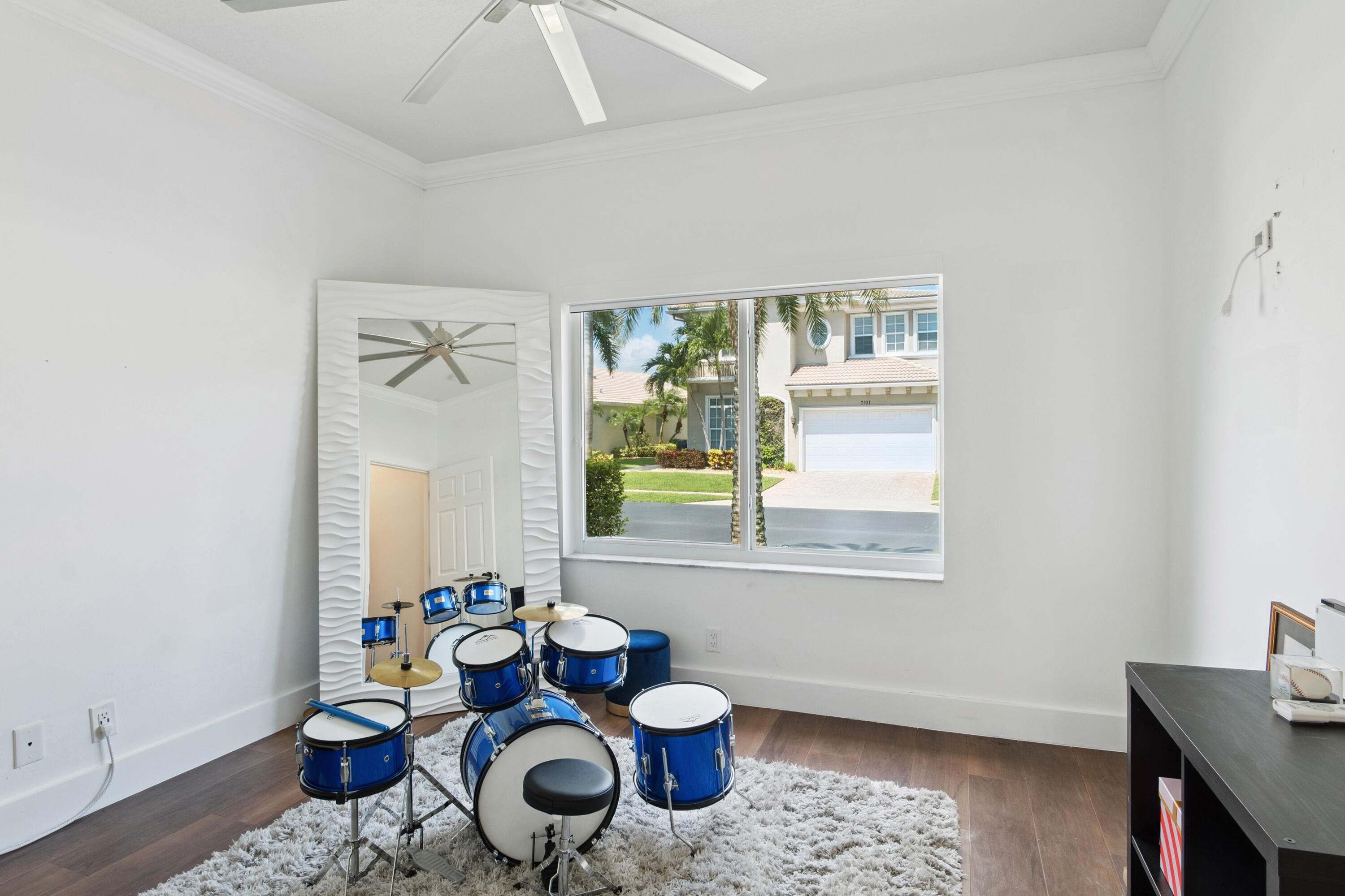 7110 Northwest Turtle Walk Boca Raton, FL 33487 - Photo 18 of 36 a living room with furniture and a window