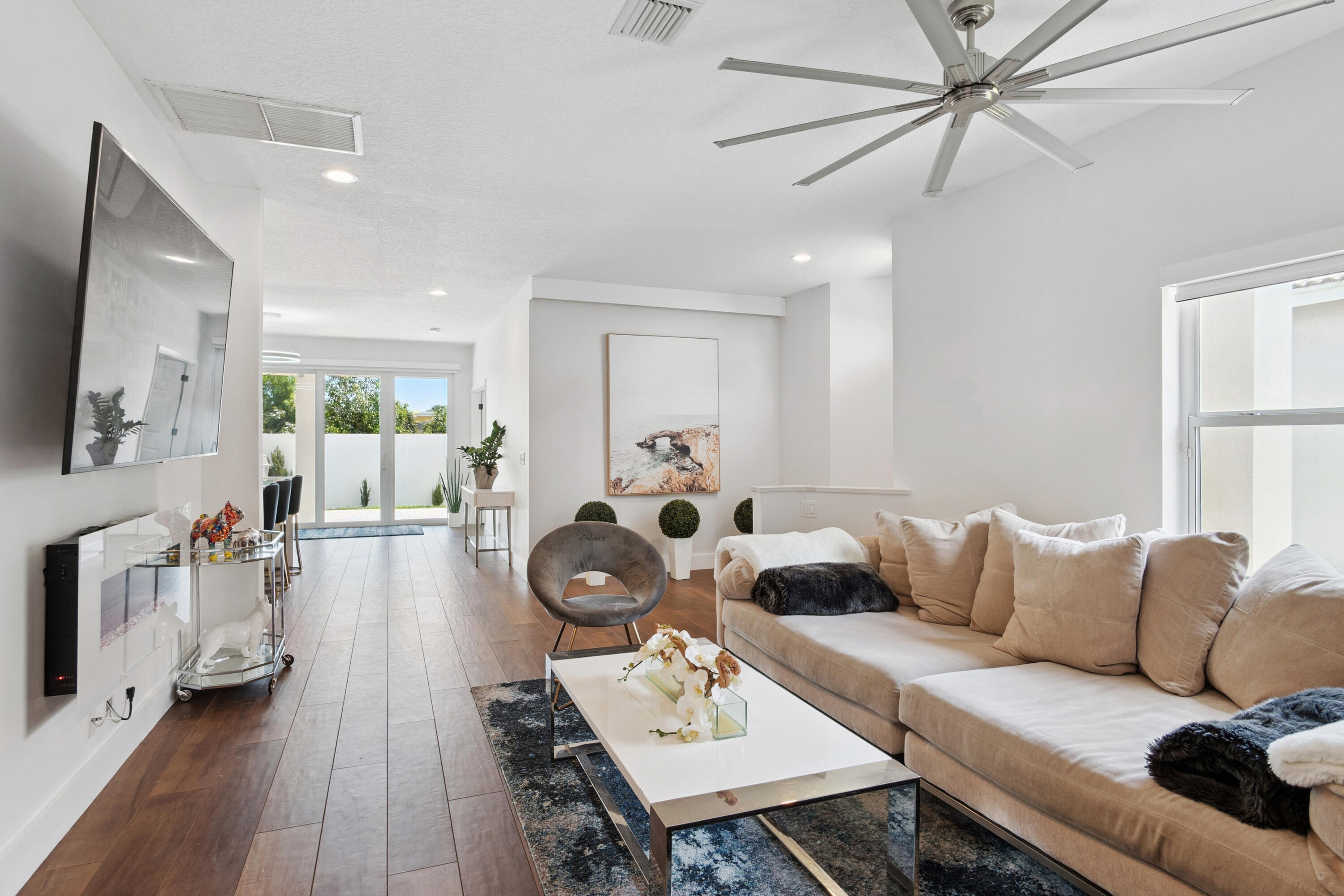 7110 Northwest Turtle Walk Boca Raton, FL 33487 - Photo 19 of 36 a living room with furniture and a wooden floor
