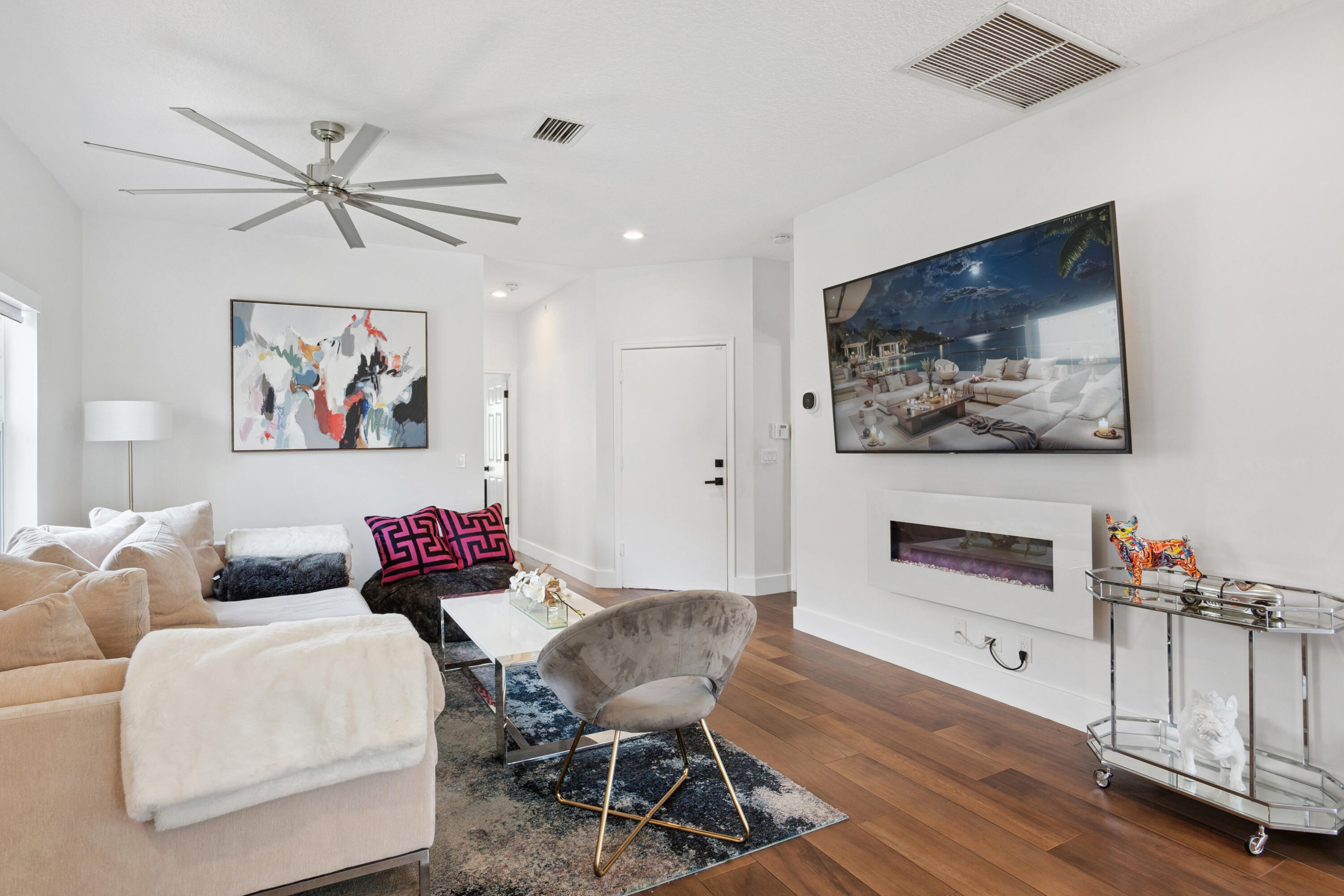 7110 Northwest Turtle Walk Boca Raton, FL 33487 - Photo 20 of 36 a living room with furniture and a chandelier