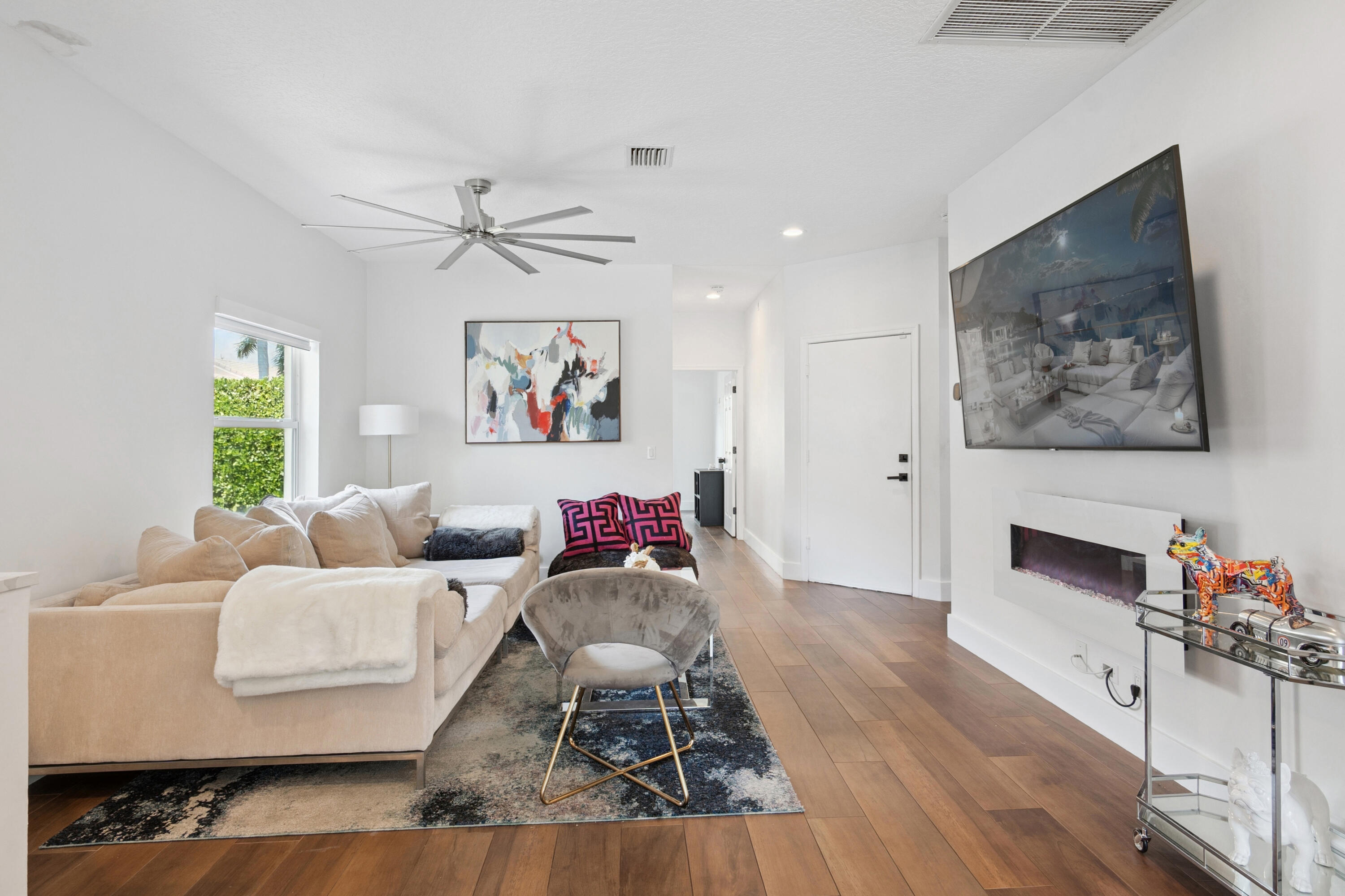 7110 Northwest Turtle Walk Boca Raton, FL 33487 - Photo 21 of 36 a living room with furniture and a flat screen tv