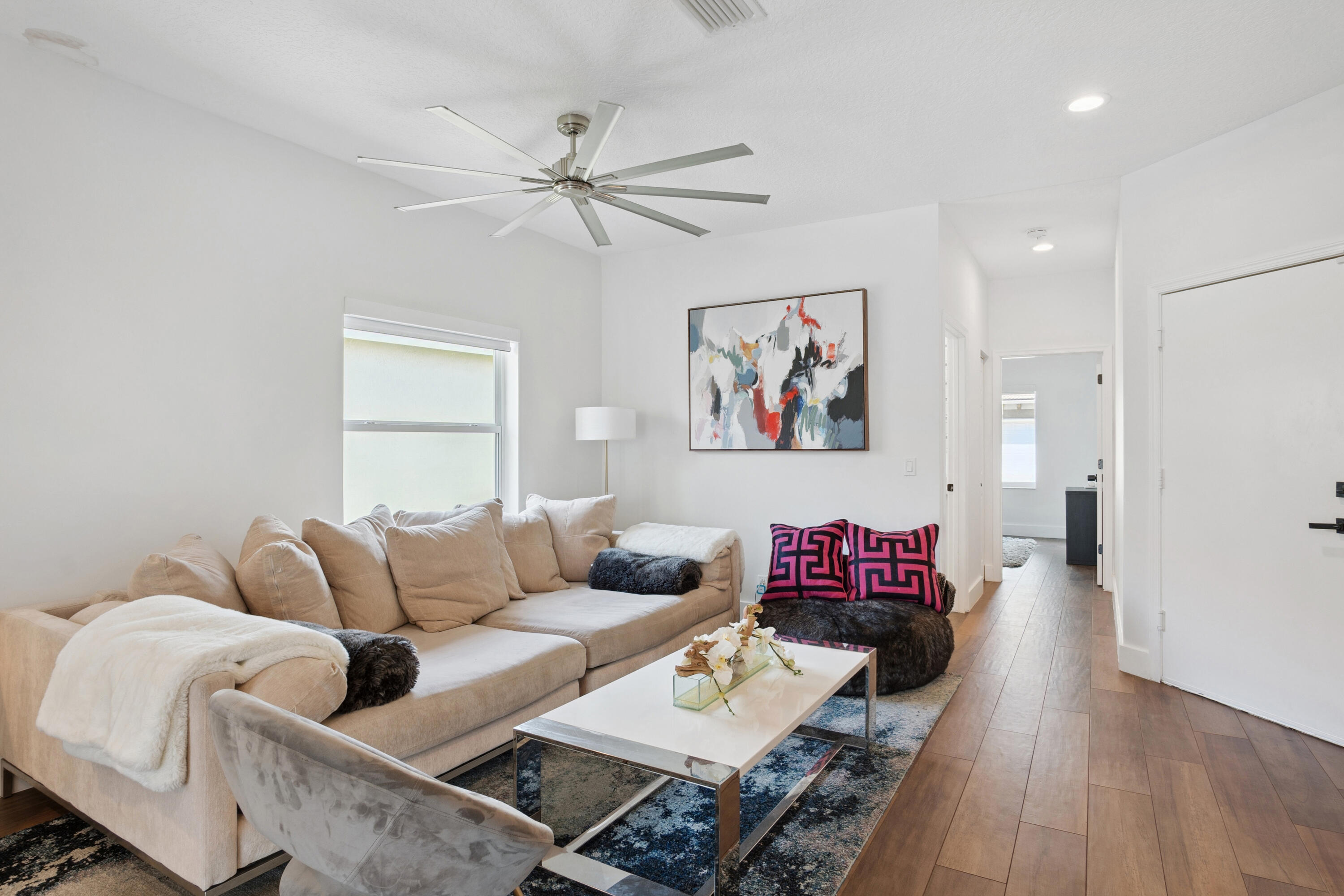 7110 Northwest Turtle Walk Boca Raton, FL 33487 - Photo 3 of 36 a living room with furniture and a wooden floor