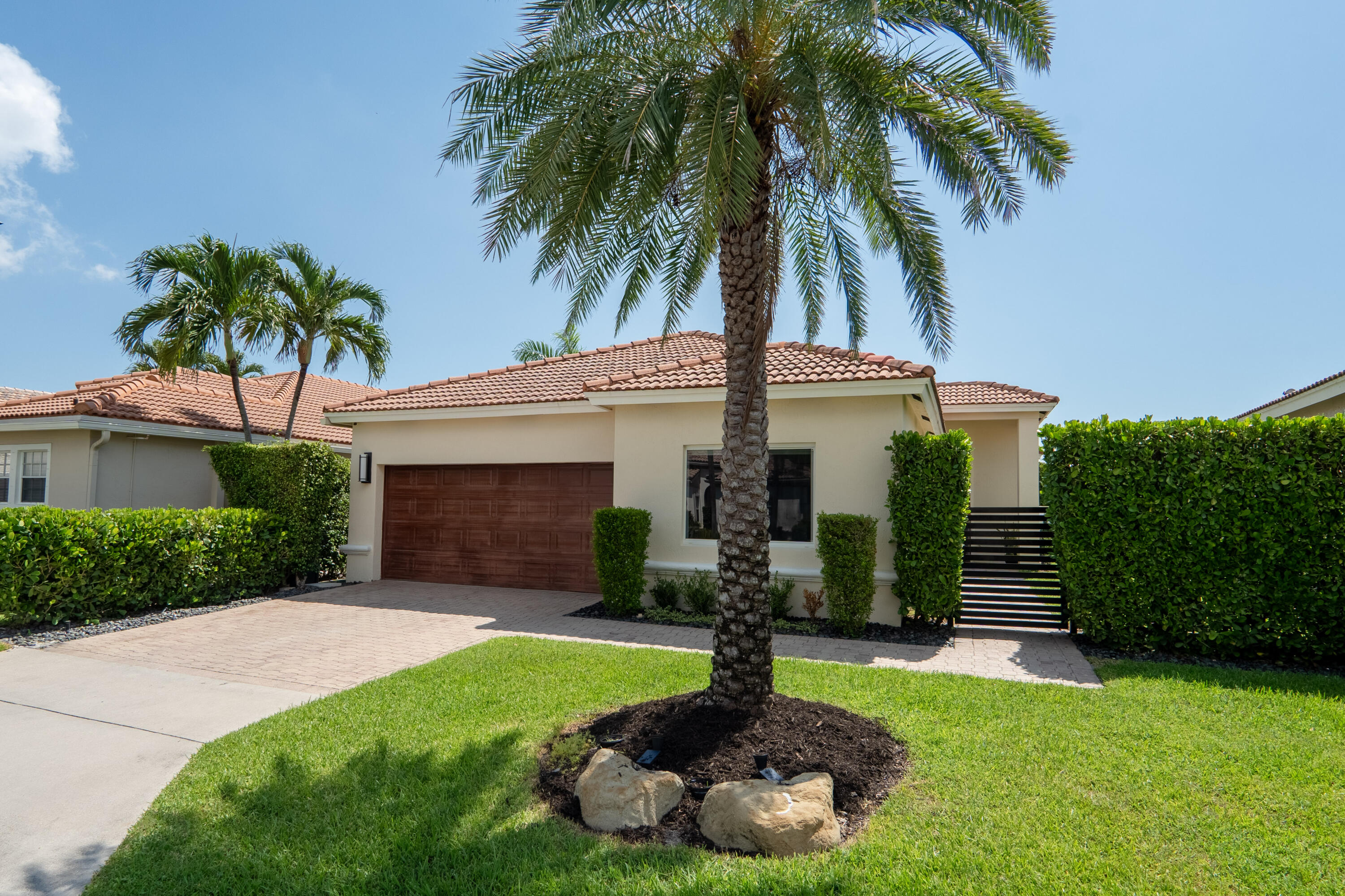 7110 Northwest Turtle Walk Boca Raton, FL 33487 - Photo 35 of 36 a front view of a house with garden