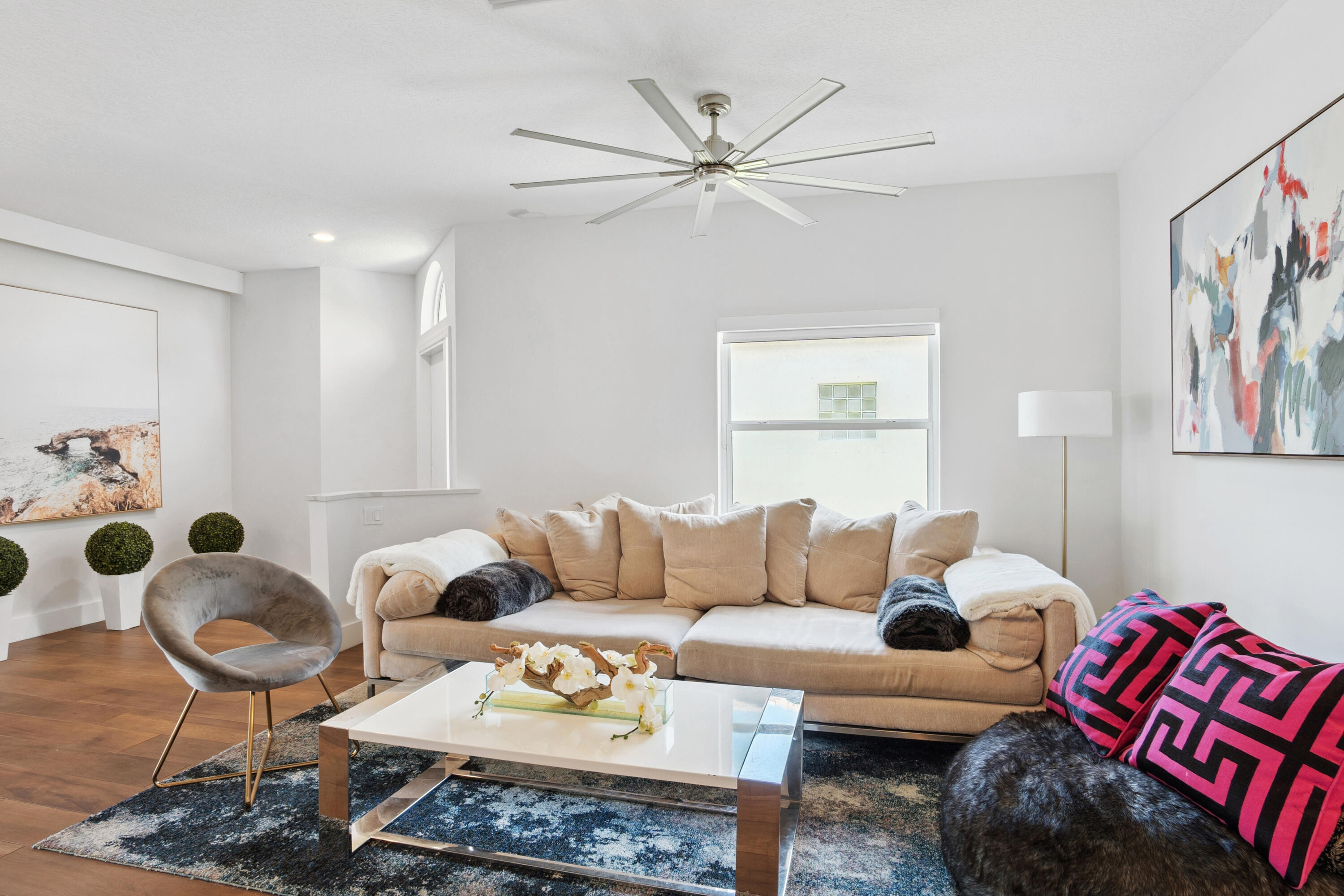 7110 Northwest Turtle Walk Boca Raton, FL 33487 - Photo 5 of 36 a living room with furniture and a rug