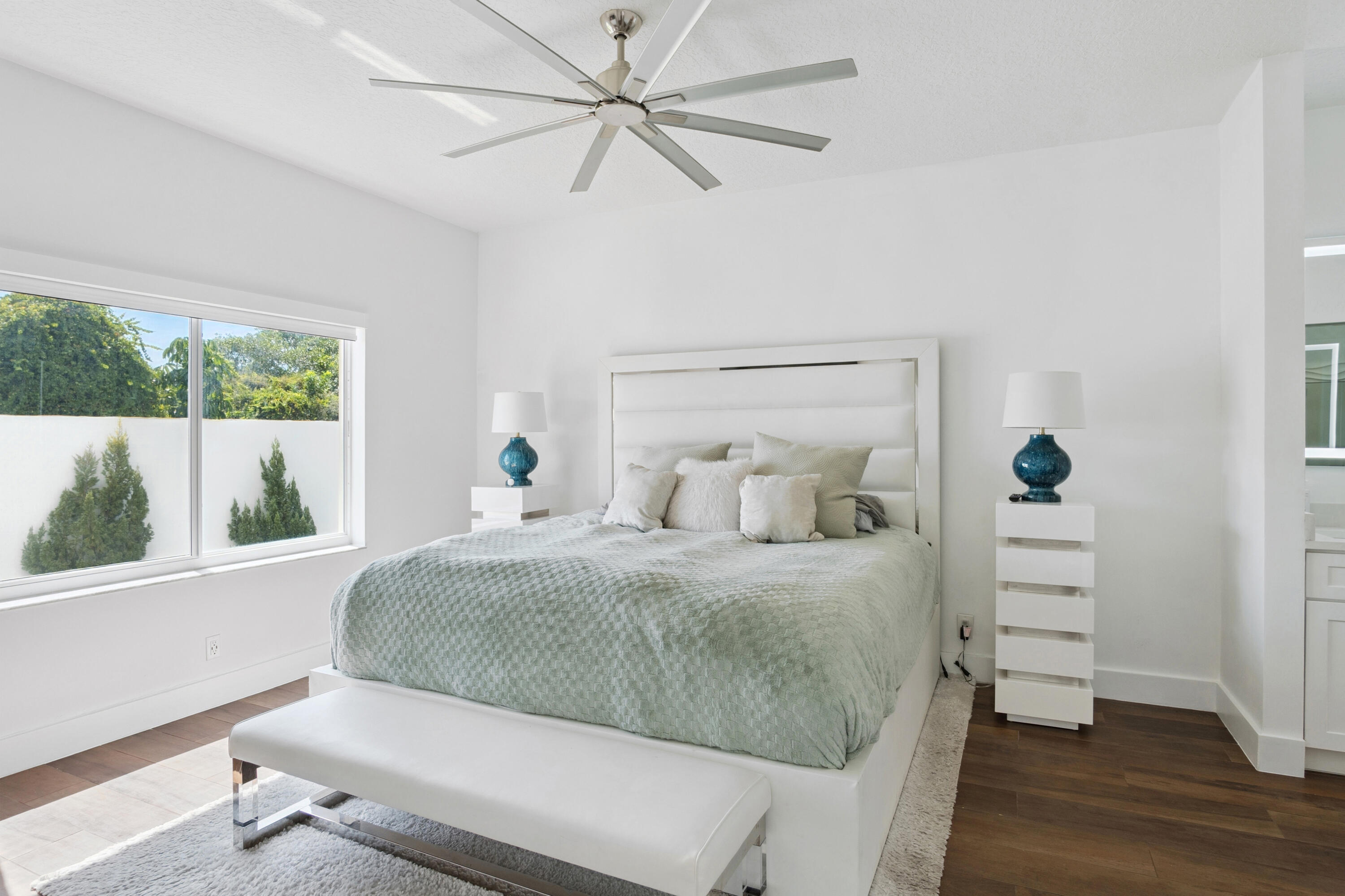 7110 Northwest Turtle Walk Boca Raton, FL 33487 - Photo 8 of 36 a bedroom with a bed and a window