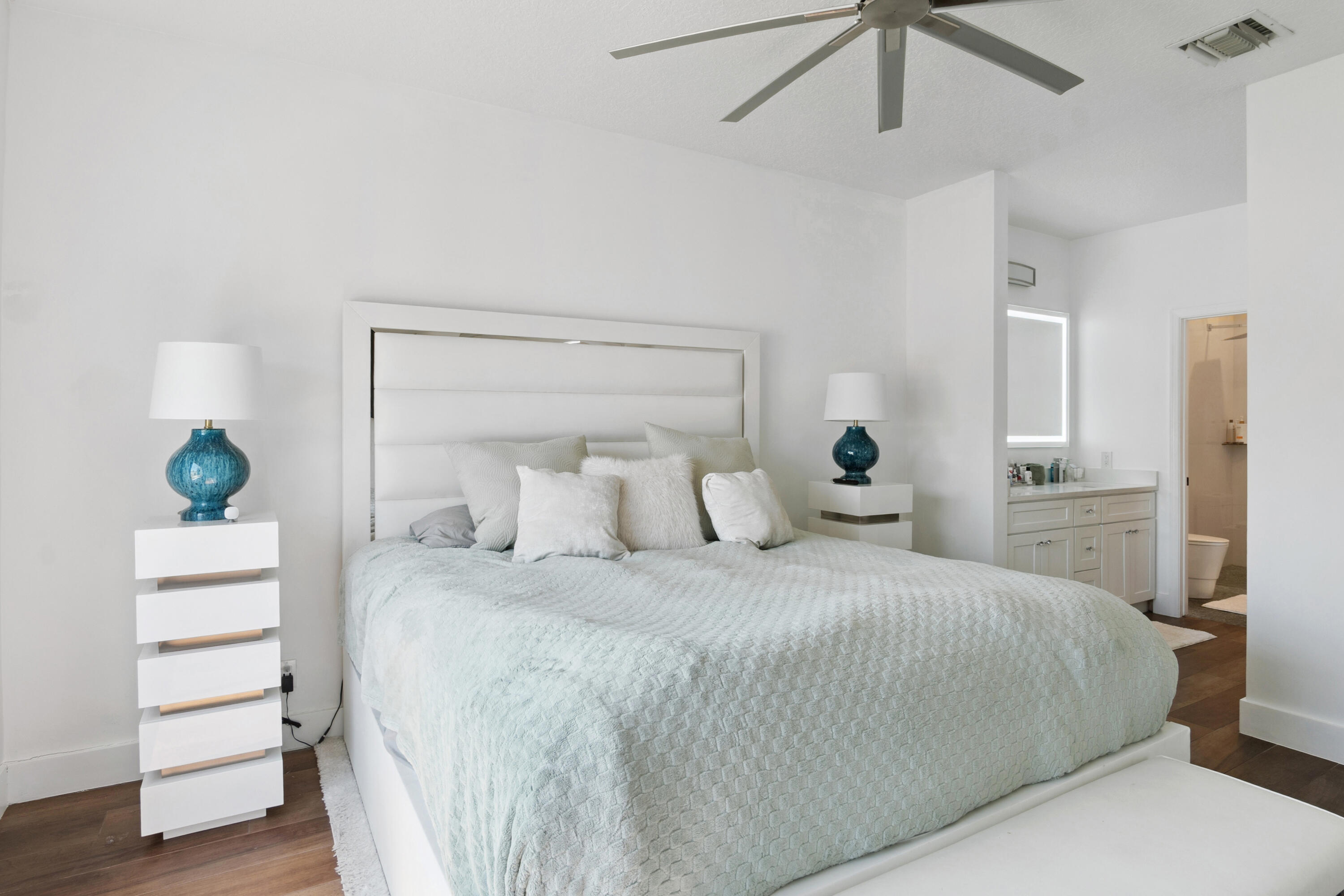 7110 Northwest Turtle Walk Boca Raton, FL 33487 - Photo 9 of 36 a bedroom with a bed and a dresser