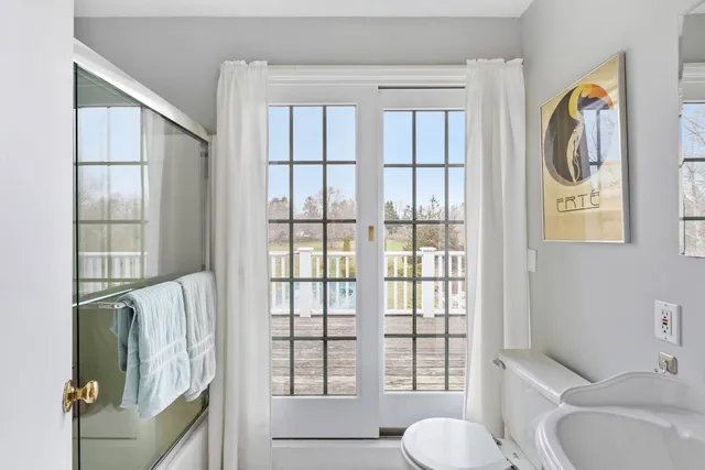 a bathroom with a toilet and a sink