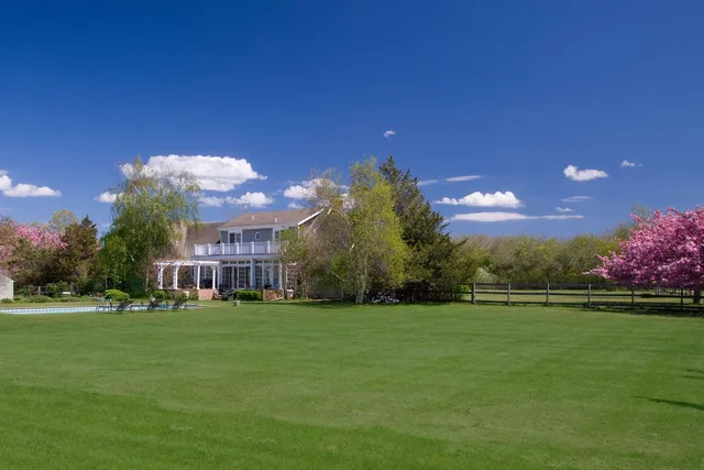a view of a house with a big yard