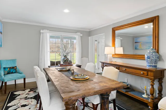 a view of a dining room with furniture and window
