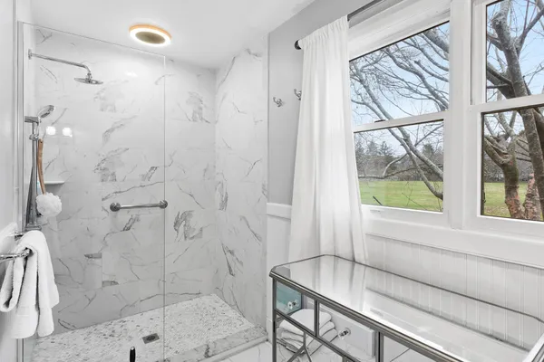 a bathroom with a shower and a bathtub