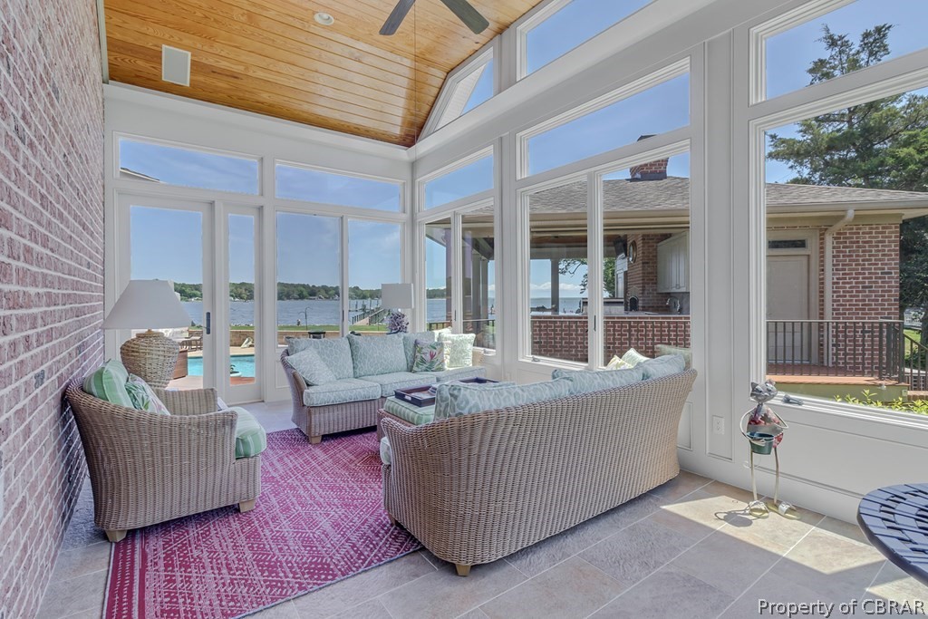 2055 Ditchley Road Kilmarnock, VA 22482 - Photo 17 of 48 Sunroom / solarium featuring wooden ceiling, a water view, ceiling fan, and vaulted ceiling