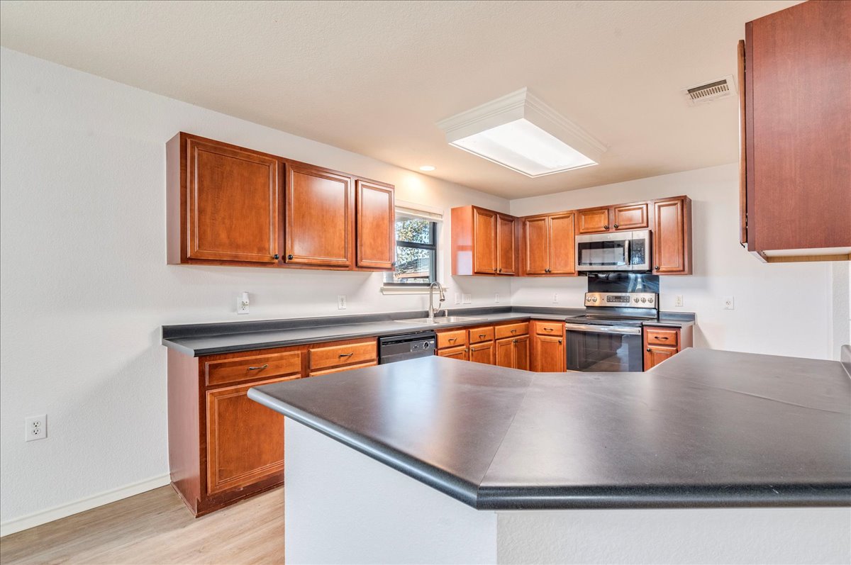 8700 Wiley Way Austin, TX 78747 - Photo 11 of 26 Huge kitchen with tons of storage.