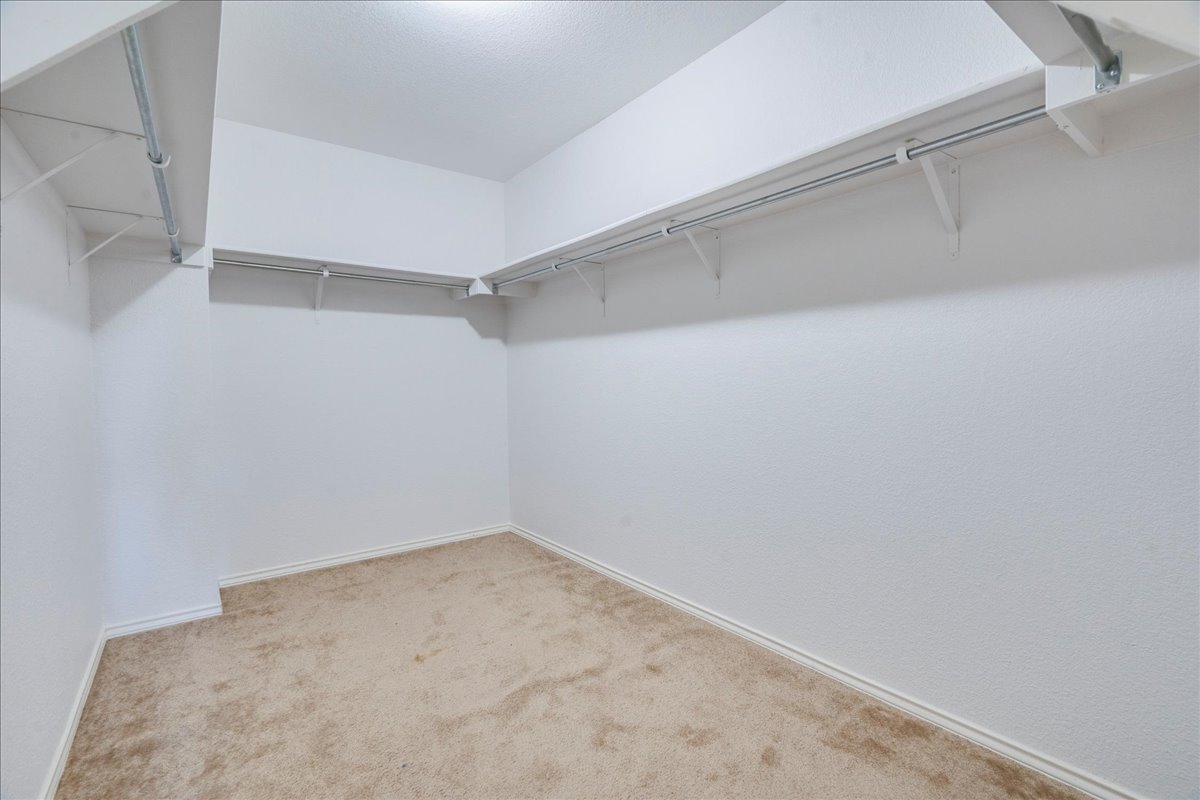 8700 Wiley Way Austin, TX 78747 - Photo 16 of 26 Walk in primary closet.