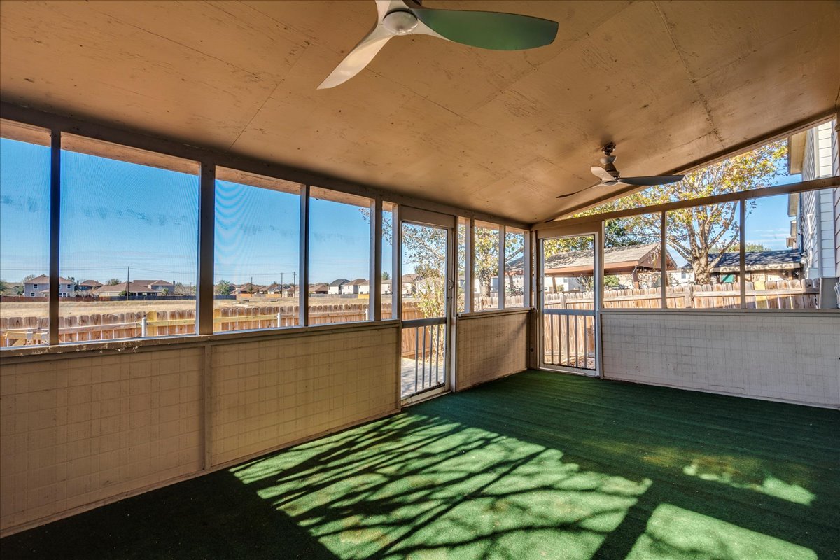 8700 Wiley Way Austin, TX 78747 - Photo 24 of 26 Covered and screened in patio overlooking the pond.