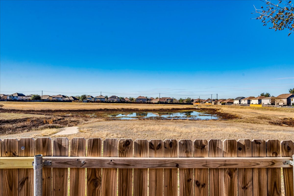 8700 Wiley Way Austin, TX 78747 - Photo 26 of 26 Private backyard overlooking the pond with NO REAR NEIGHBORS.