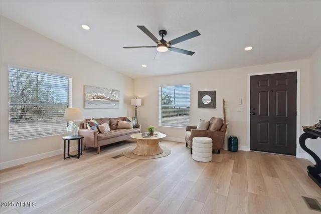a living room with furniture and a large window