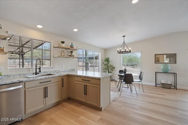 a kitchen with a sink stove and refrigerator