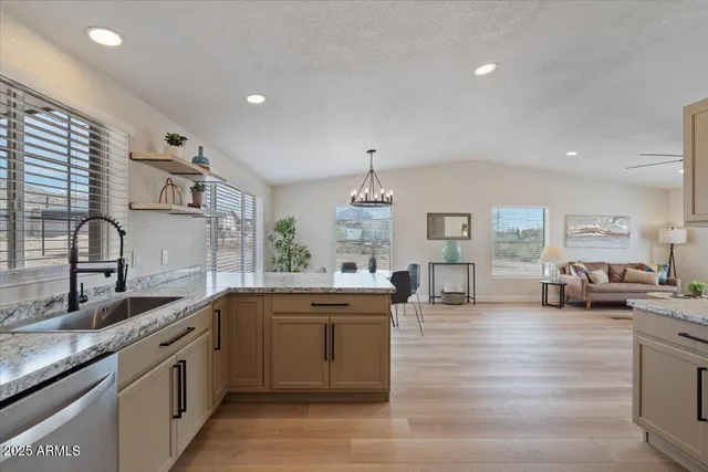 a view of a livingroom with furniture window and wooden floor