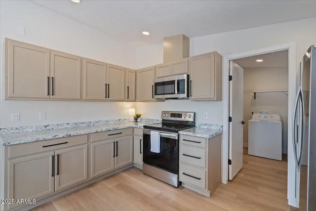 a view of a room with wooden floor and closet