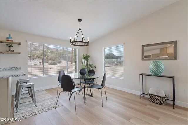 a bathroom with a toilet a sink a mirror and vanity