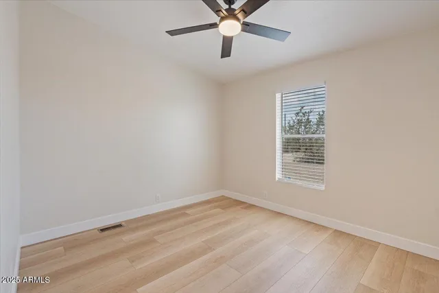 a spacious bathroom with a double vanity sink mirror and bathtub