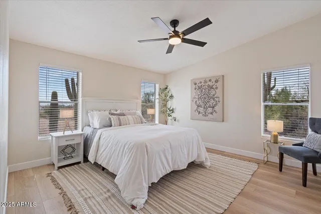 a spacious bathroom with a double vanity sink a mirror and a shower