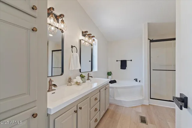 a front view of a house with a yard and mountain view