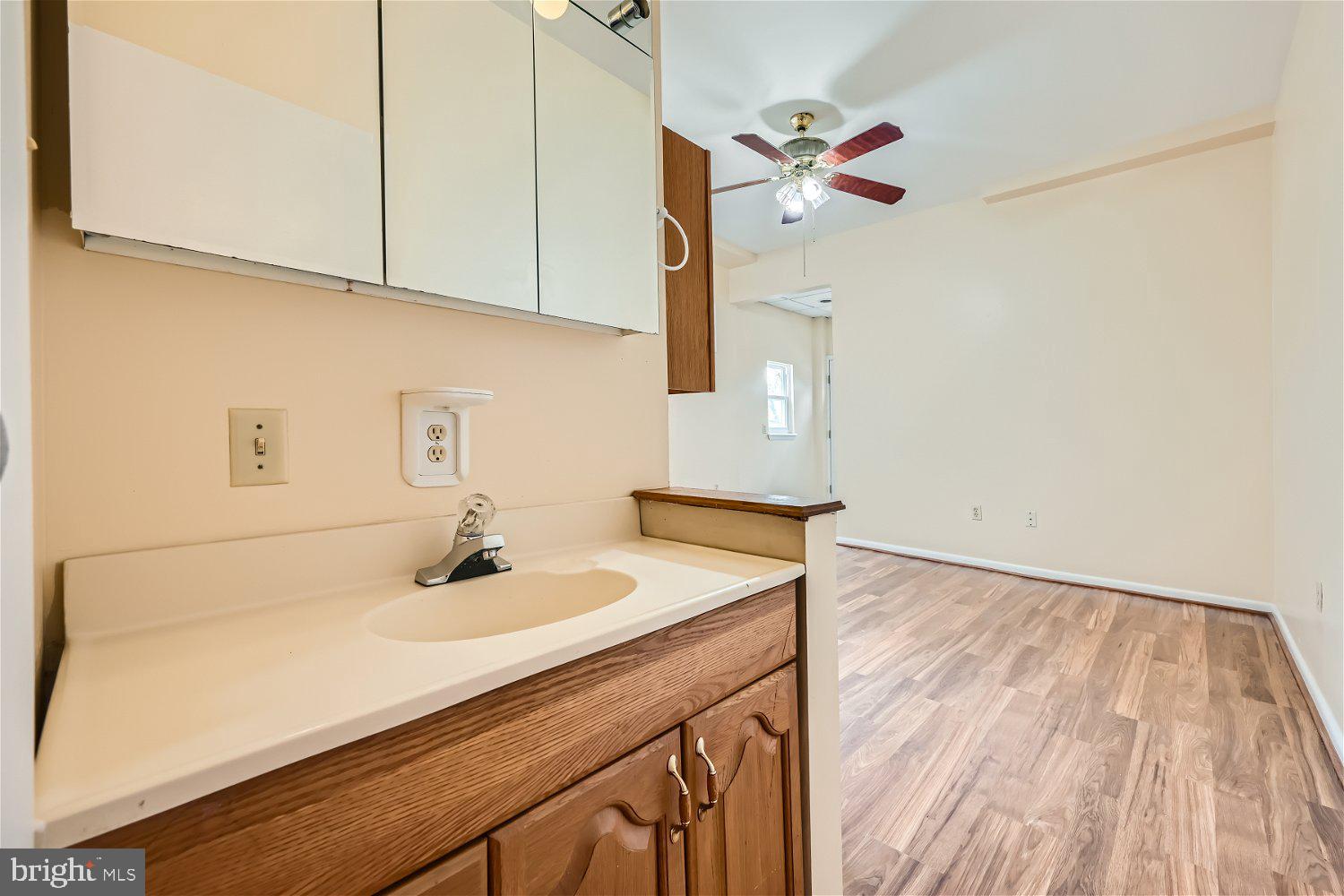 716 South Camp Meade Road, Unit A Linthicum Heights, MD 21090 - Photo 9 of 11 a bathroom with a sink and a mirror