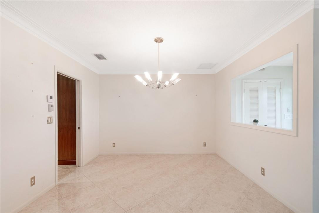 612 Canistel Lane Boca Raton, FL 33486 - Photo 6 of 19 Diving Room leading to Kitchen