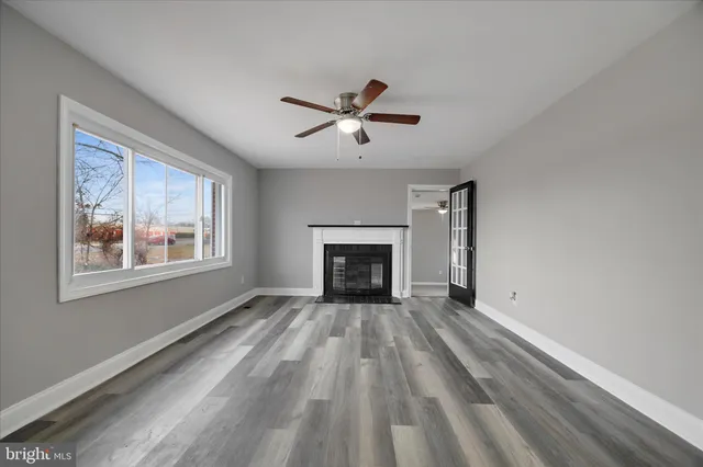 a view of an empty room with a window