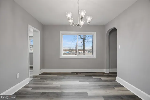 a bathroom with a shower a toilet and a sink