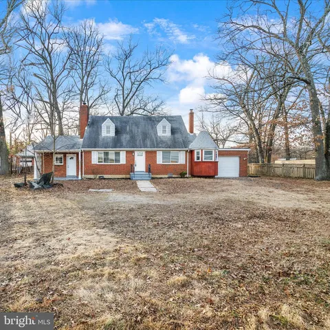a large kitchen with cabinets stainless steel appliances and a center island