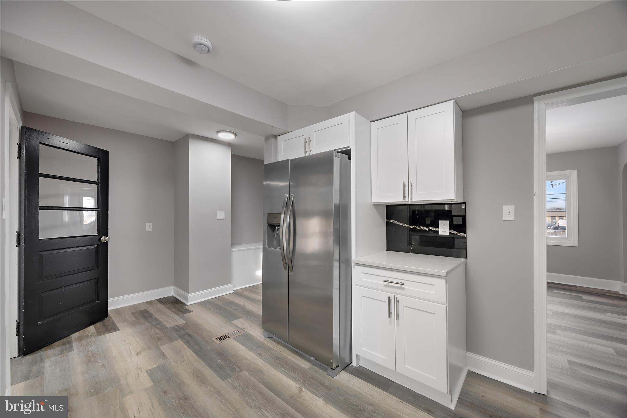 4007 Forestville Road District Heights, MD 20747 - Photo 4 of 45 a kitchen with stainless steel appliances a refrigerator and cabinets