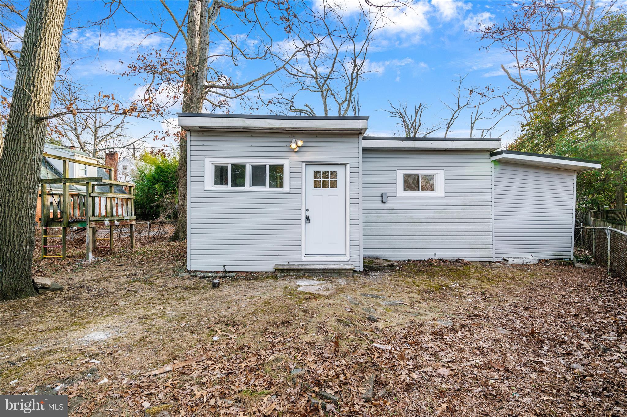 4007 Forestville Road District Heights, MD 20747 - Photo 41 of 45 a view of a house with a small yard and a large tree