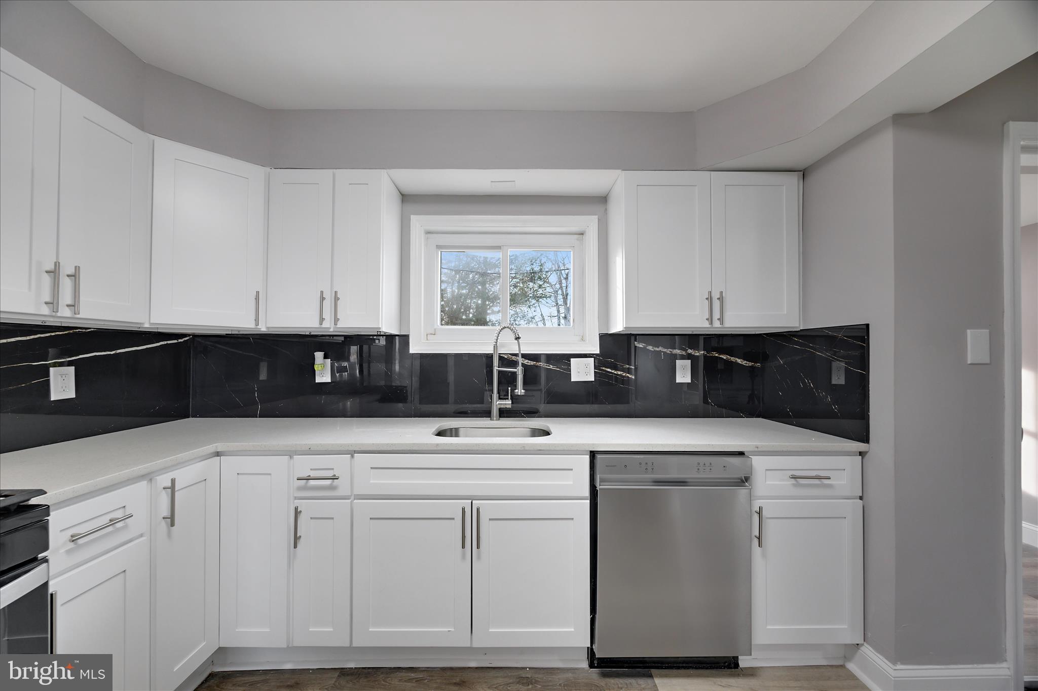 4007 Forestville Road District Heights, MD 20747 - Photo 5 of 45 a kitchen with white cabinets appliances and sink