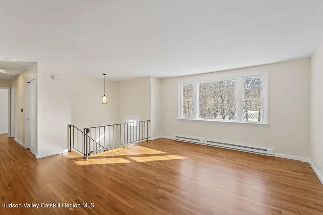 a view of an empty room with glass door