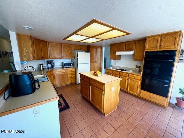2240 Springdale Court Reno, NV 89523 - Photo 5 of 24 a kitchen with stainless steel appliances granite countertop a stove a sink and a microwave