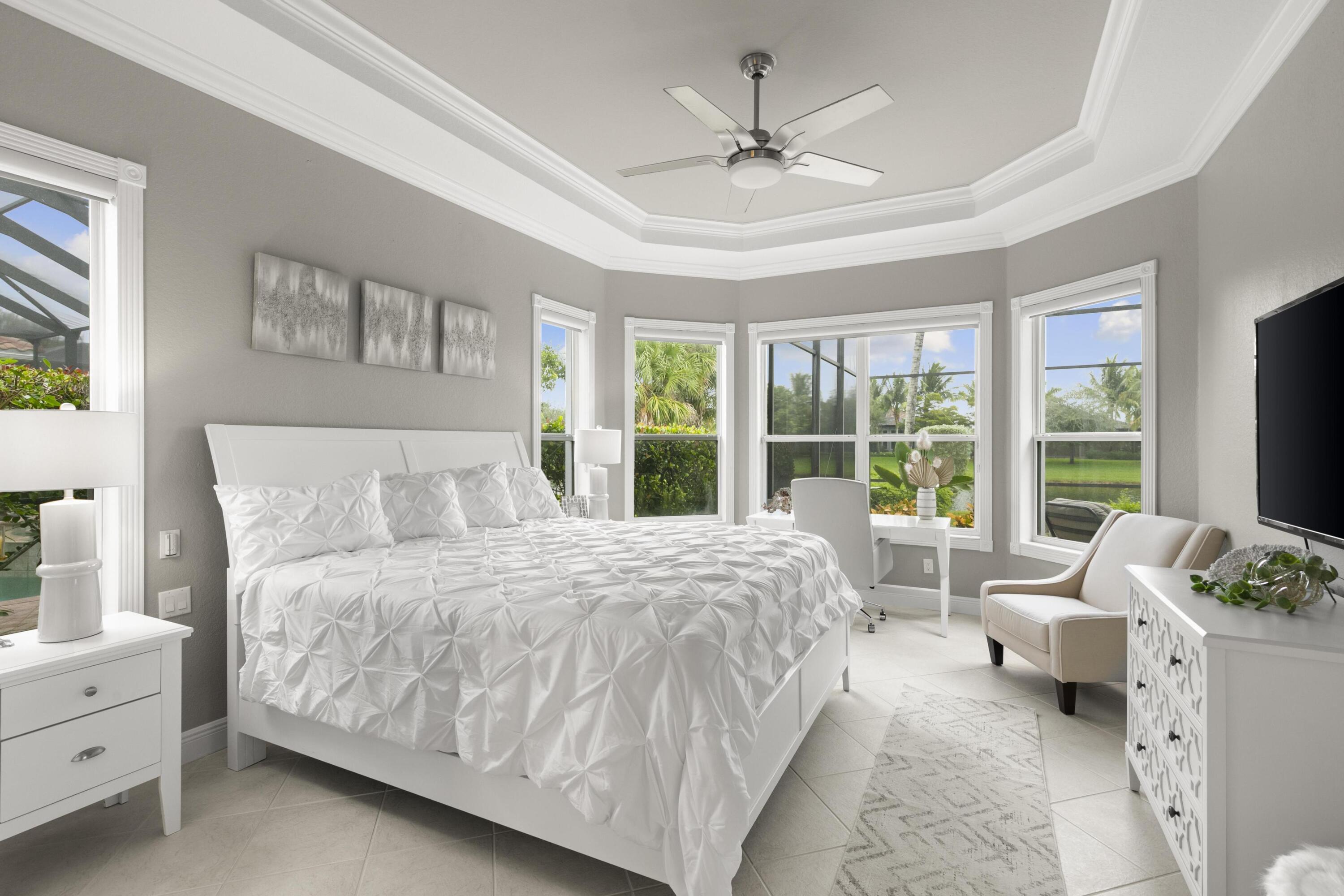 9100 Cherry Oaks Trail Naples, FL 34114 - Photo 15 of 33 a spacious bedroom with a bed and a window