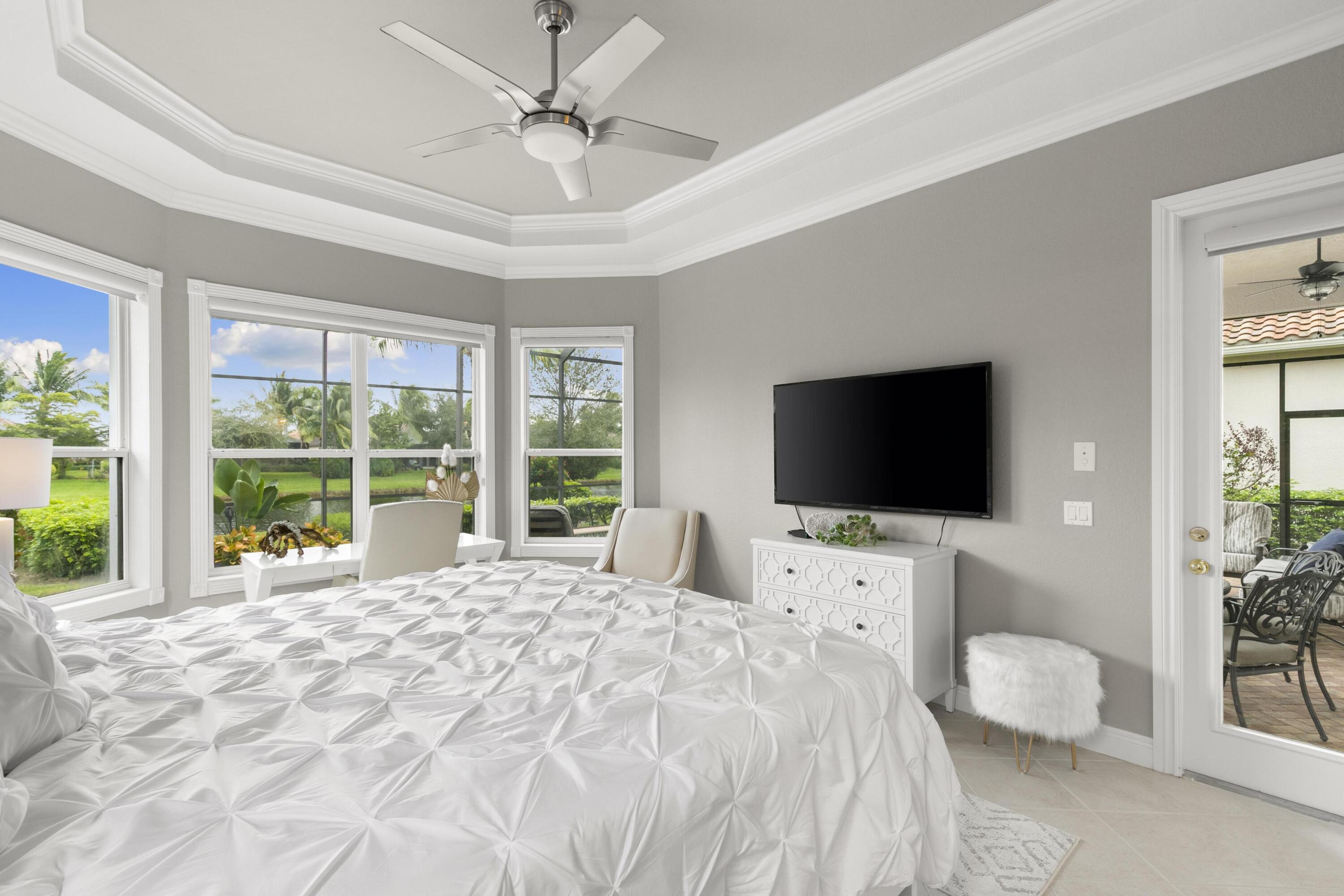 9100 Cherry Oaks Trail Naples, FL 34114 - Photo 16 of 33 a bedroom with a large bed and a flat screen tv