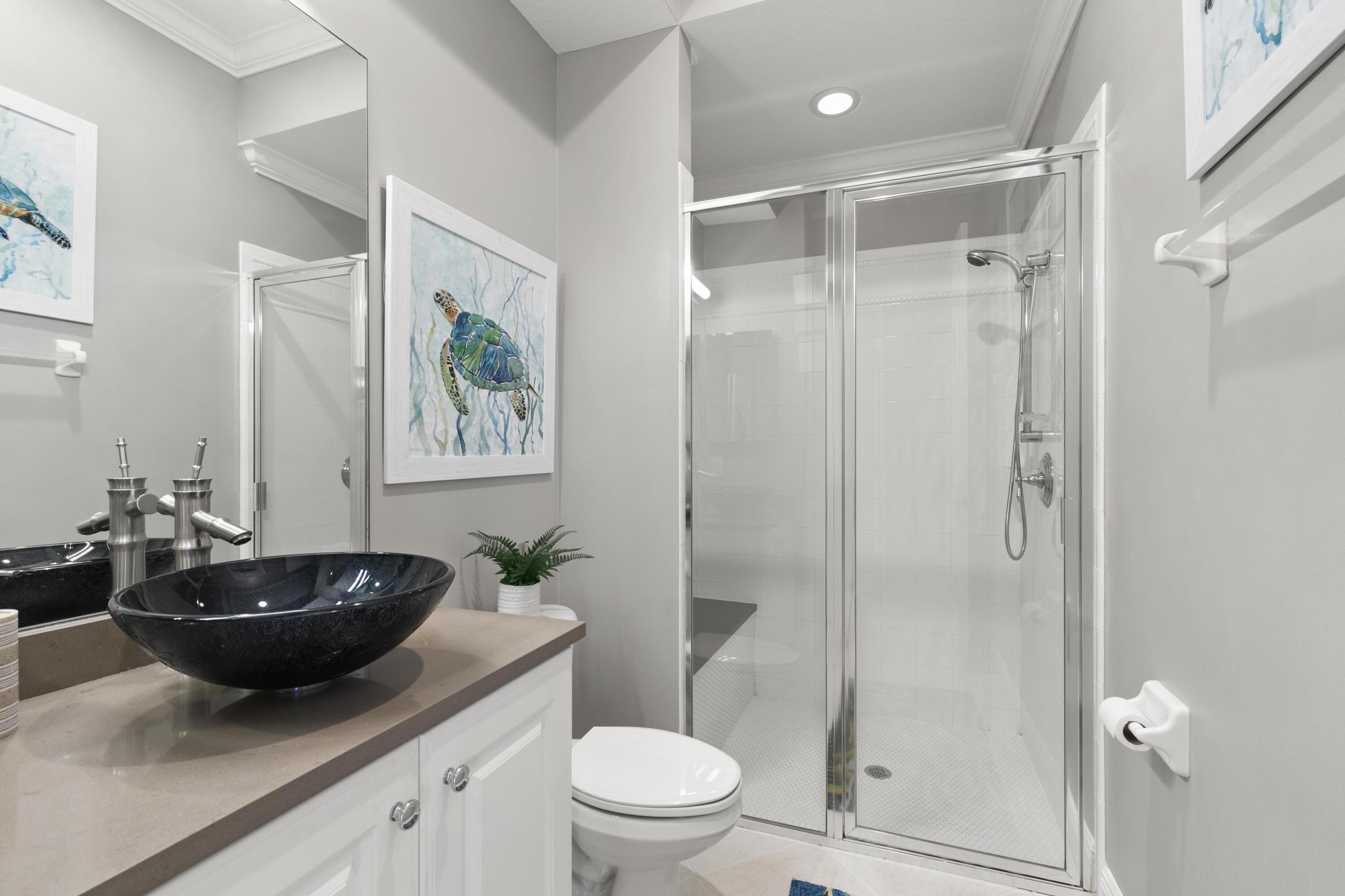 9100 Cherry Oaks Trail Naples, FL 34114 - Photo 19 of 33 a bathroom with a sink a toilet and shower