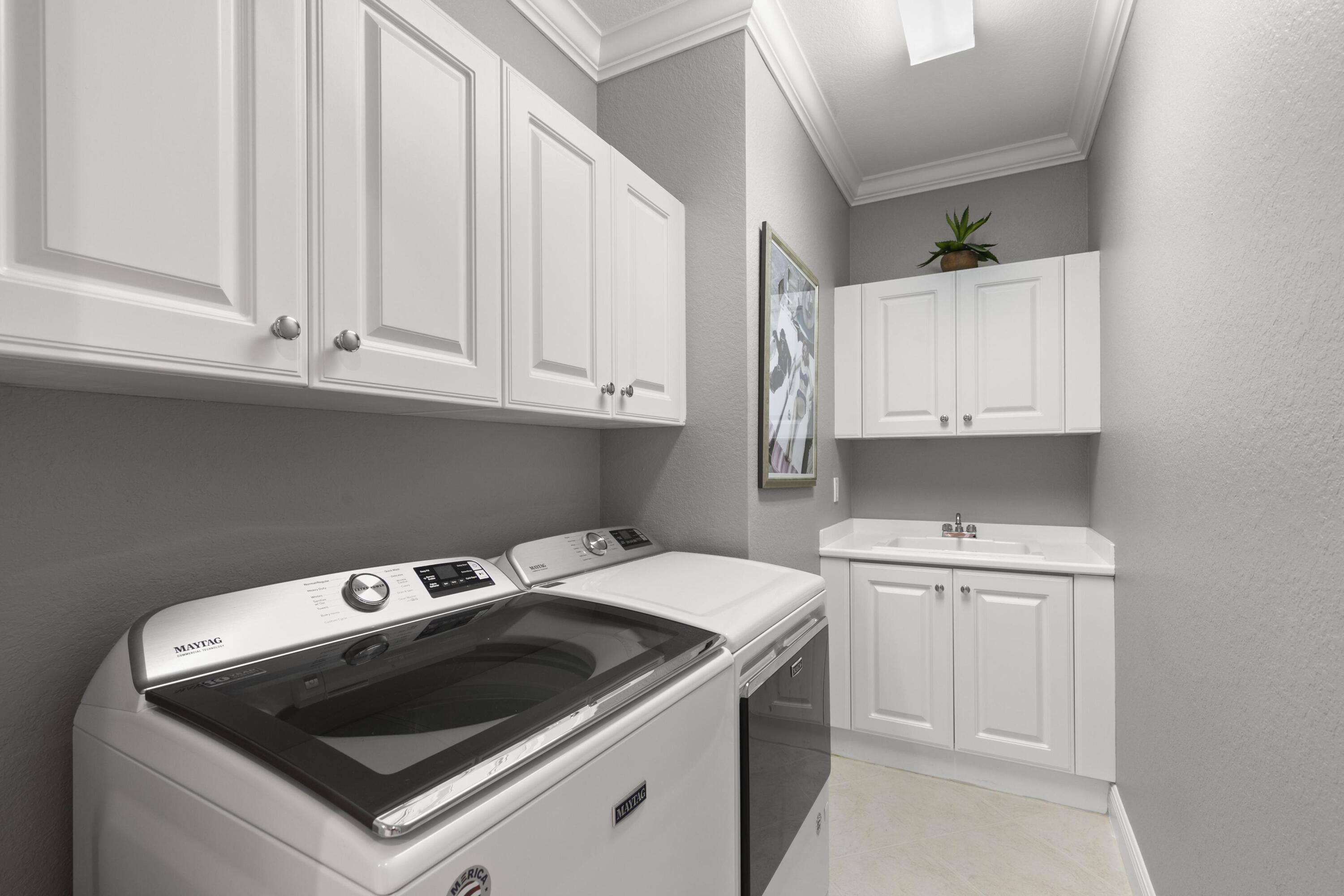 9100 Cherry Oaks Trail Naples, FL 34114 - Photo 21 of 33 a utility room with dryer and washer
