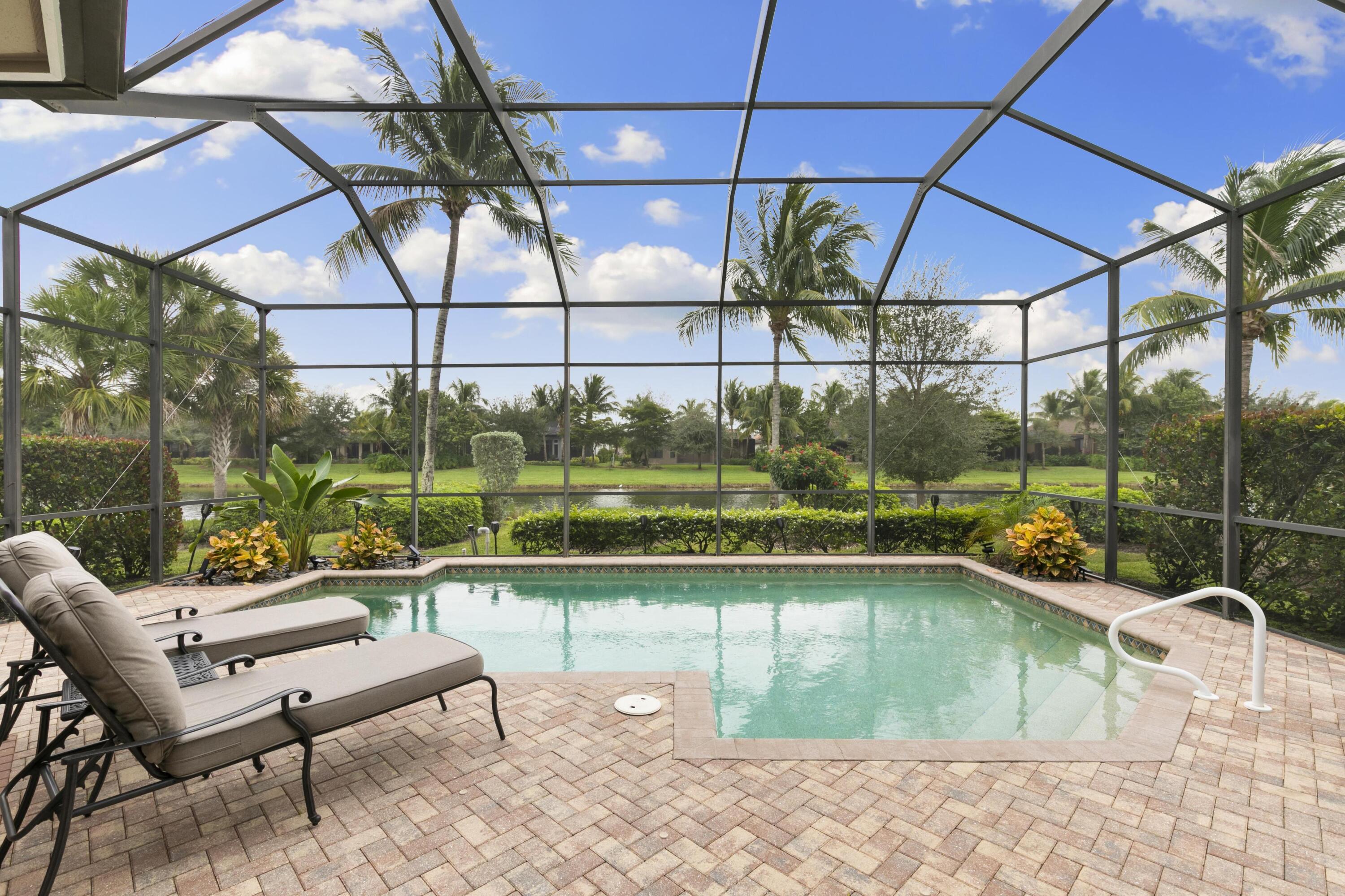 9100 Cherry Oaks Trail Naples, FL 34114 - Photo 23 of 33 a view of a swimming pool with a patio