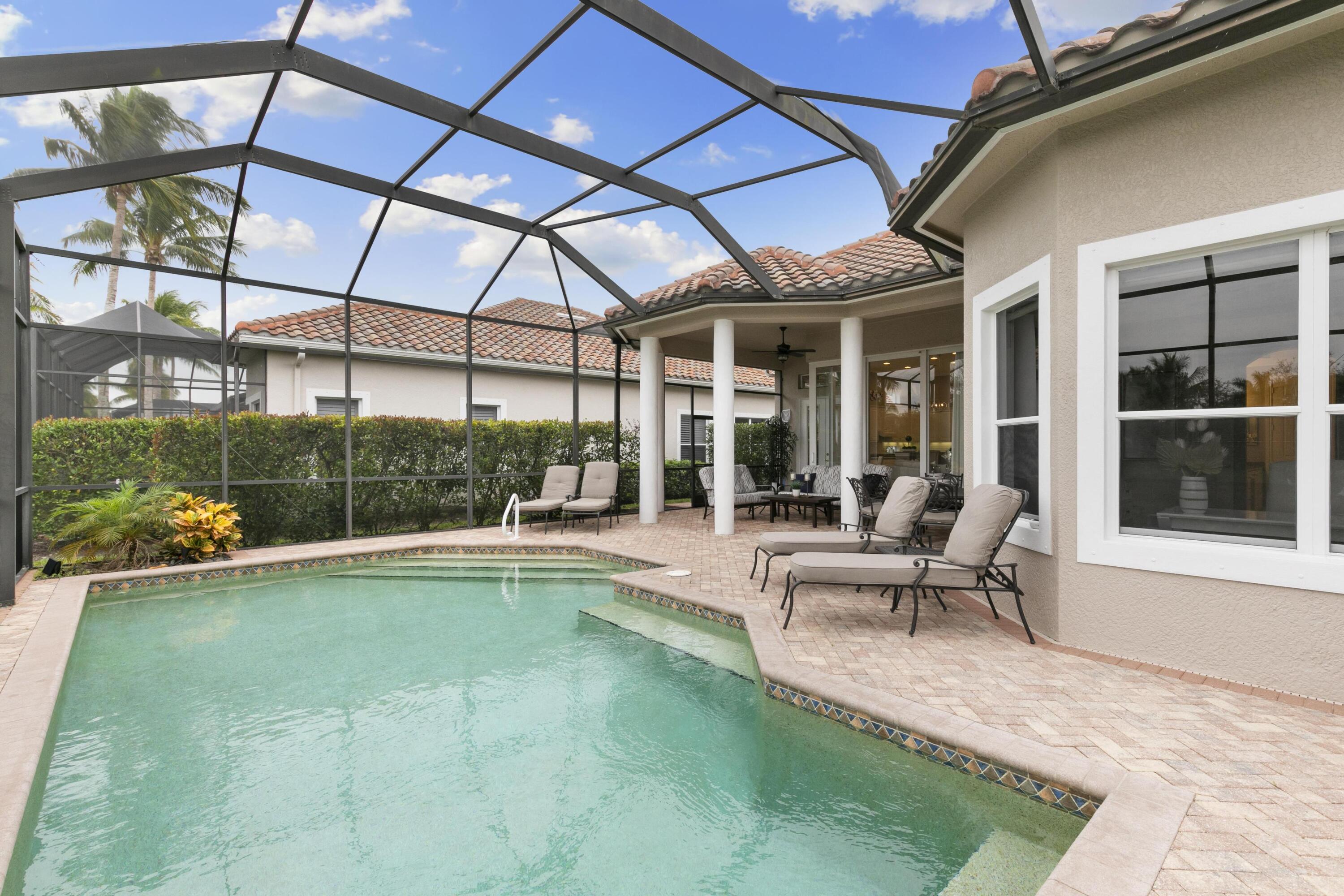 9100 Cherry Oaks Trail Naples, FL 34114 - Photo 25 of 33 a view of a patio with table and chairs and potted plants