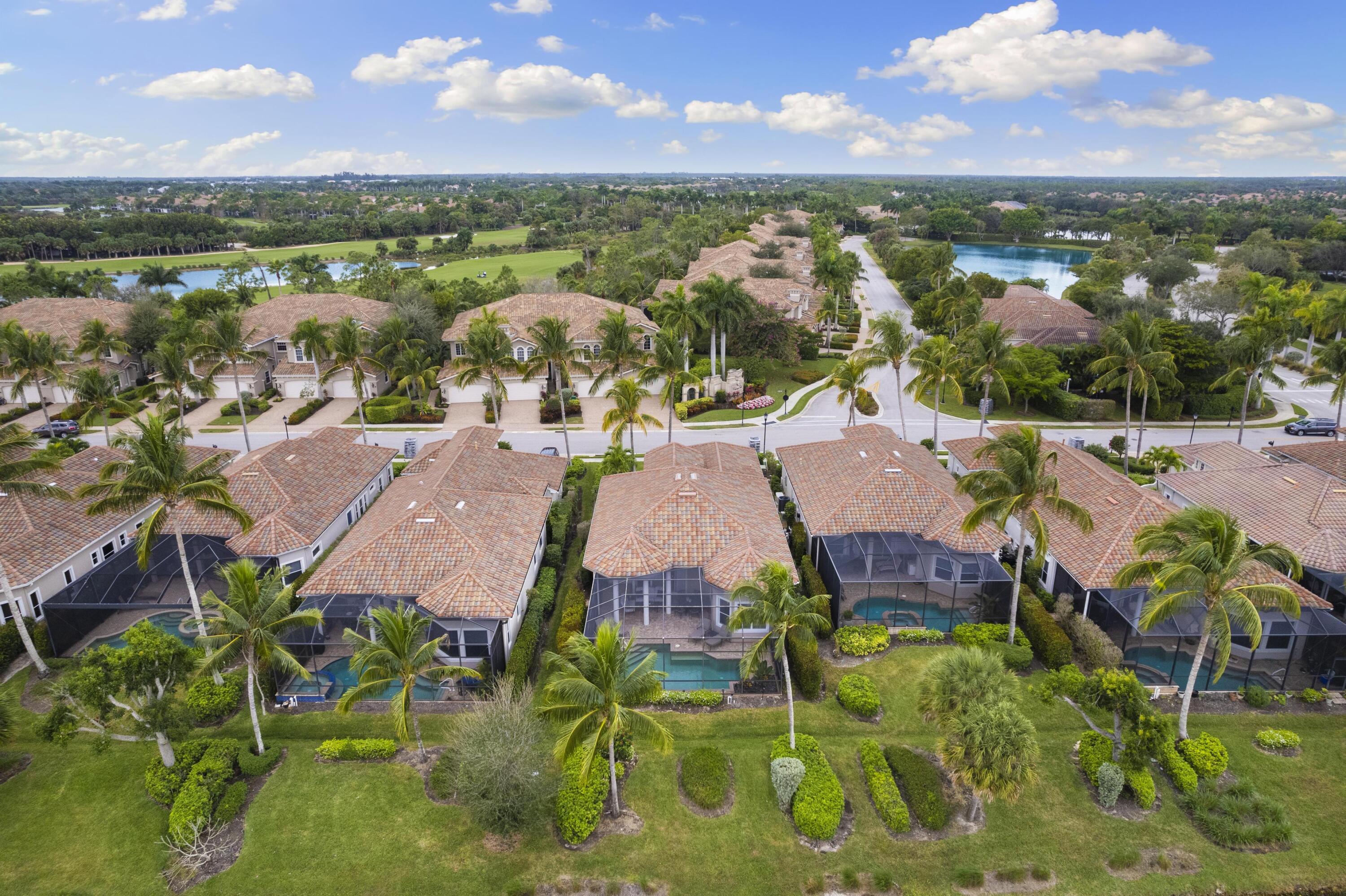 9100 Cherry Oaks Trail Naples, FL 34114 - Photo 27 of 33 an aerial view of residential houses with outdoor space and lake view