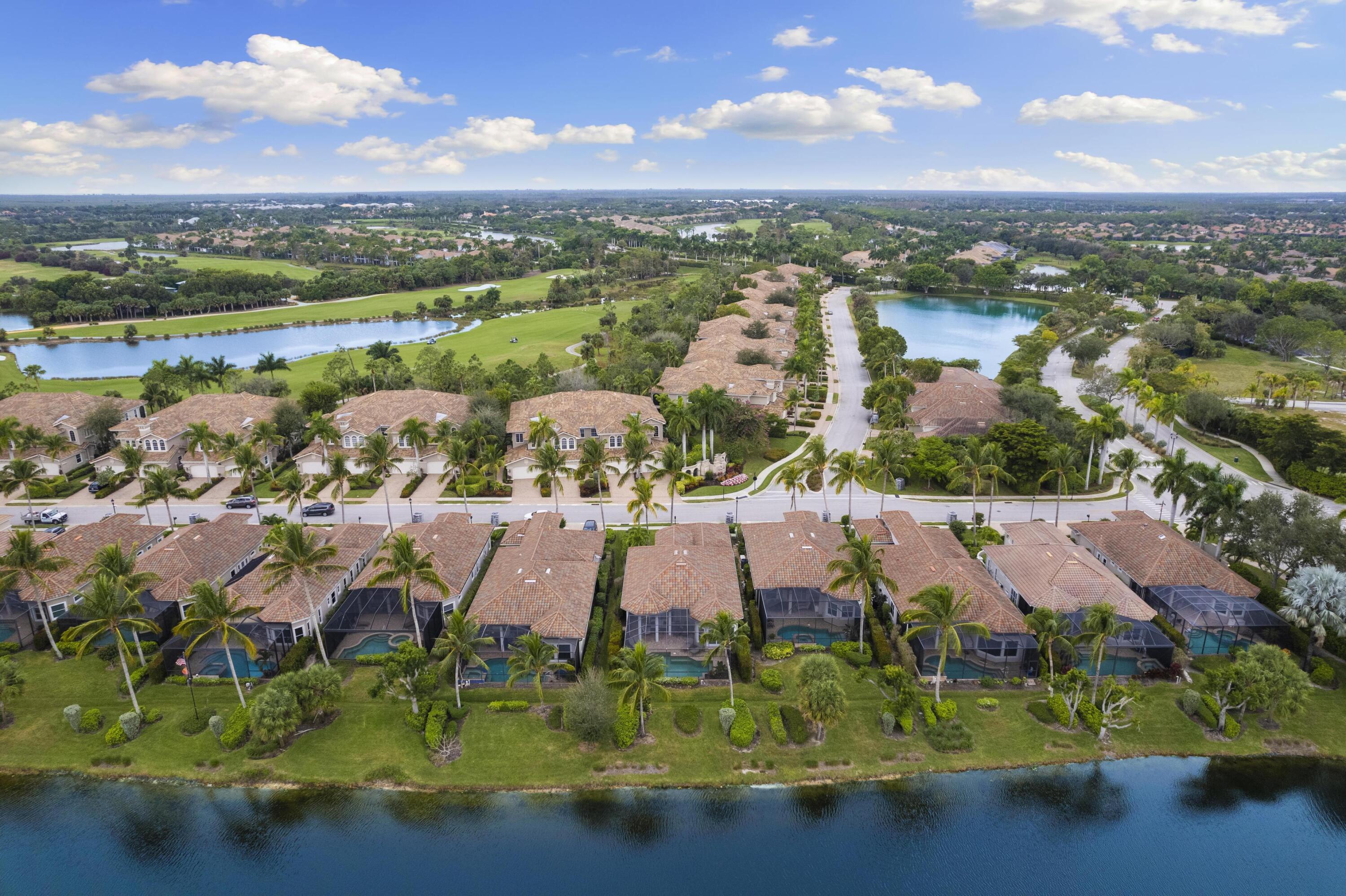 9100 Cherry Oaks Trail Naples, FL 34114 - Photo 28 of 33 an aerial view of residential houses with outdoor space and lake view
