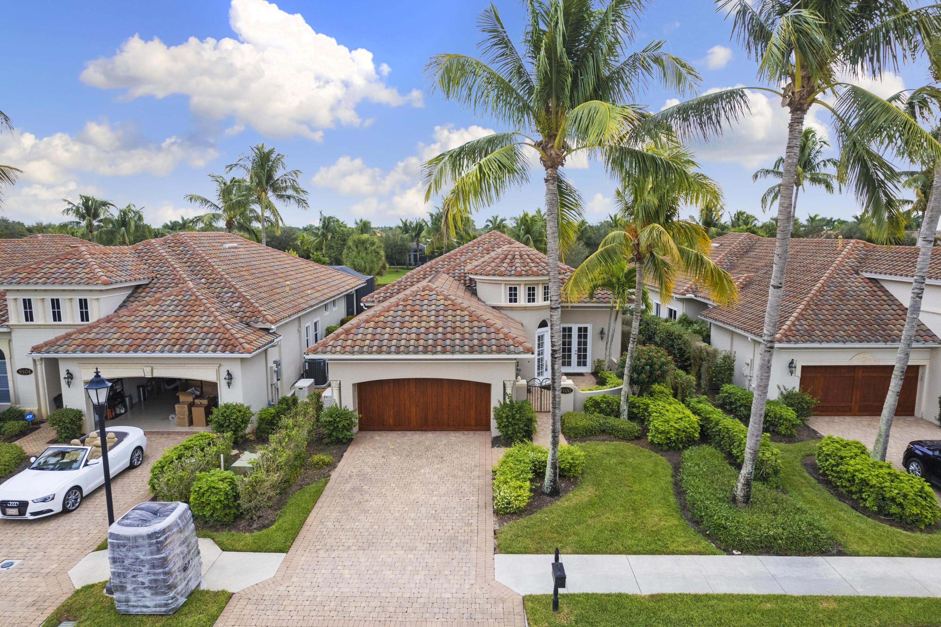 9100 Cherry Oaks Trail Naples, FL 34114 - Photo 4 of 33 a aerial view of a house with a yard and potted plants