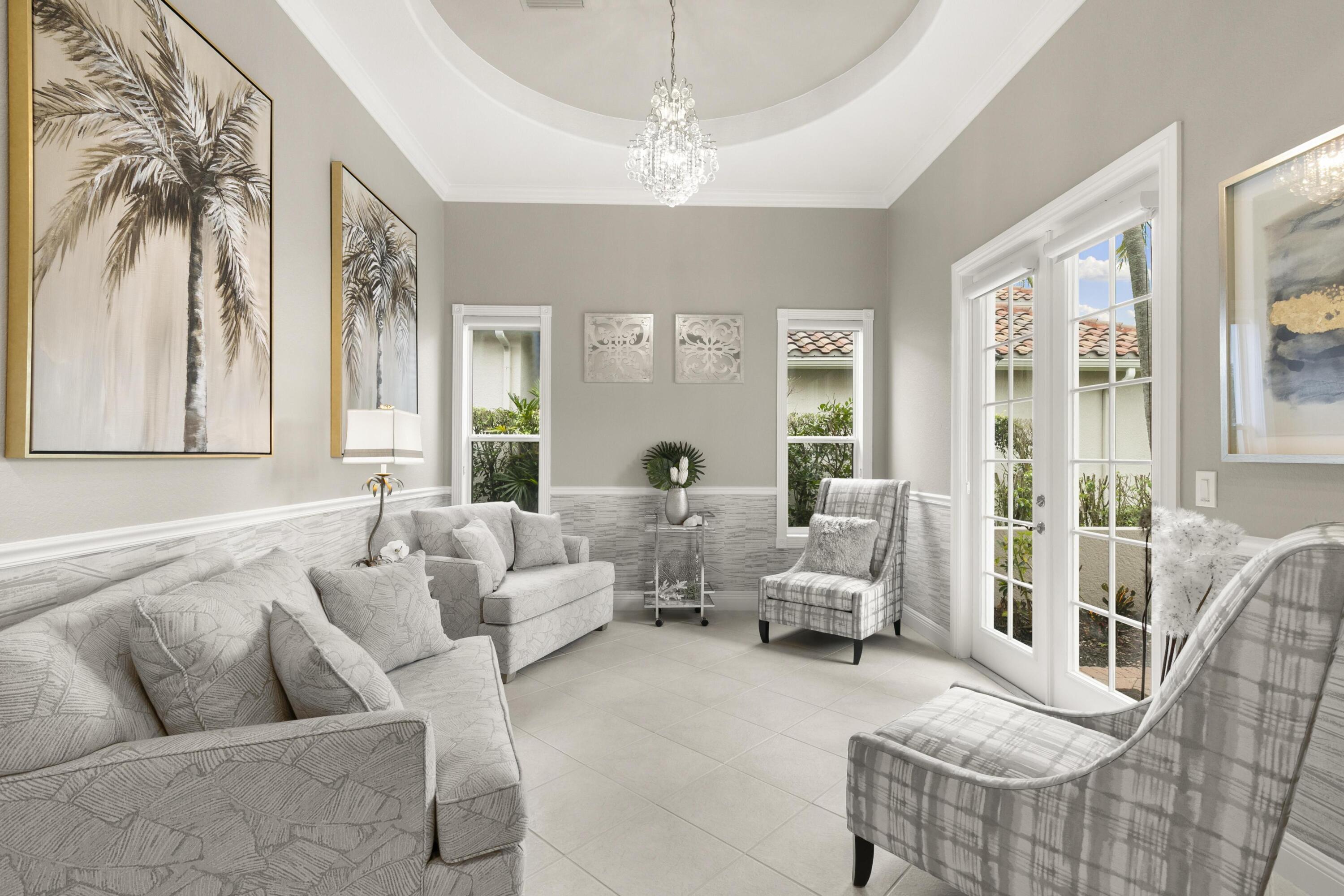 9100 Cherry Oaks Trail Naples, FL 34114 - Photo 7 of 33 a living room with furniture and a large window