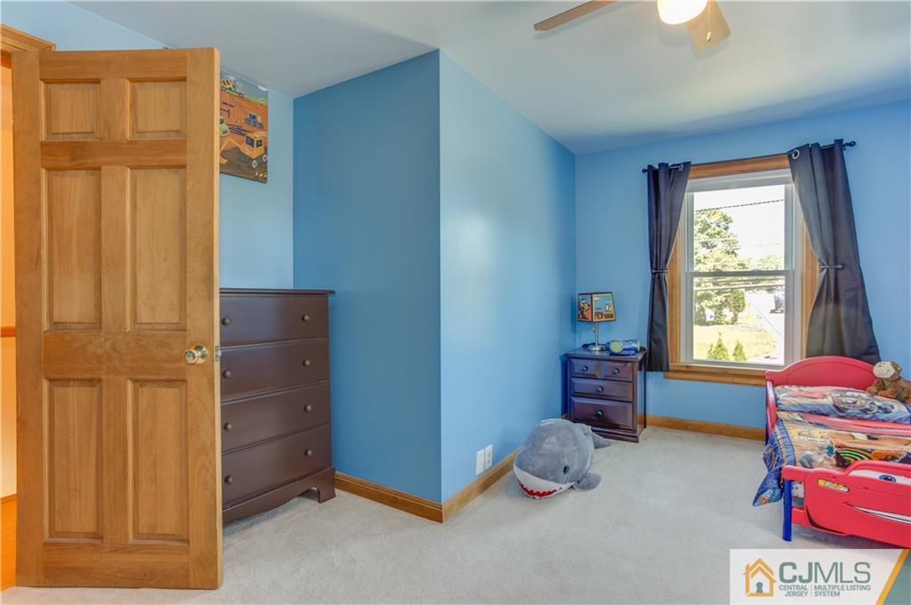 659 Ridge Road Monmouth Junction, NJ 08852 - Photo 14 of 24 a room with toys and two windows