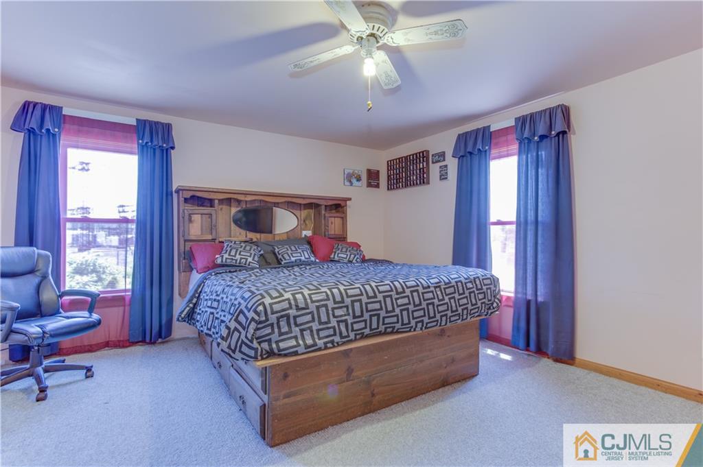 659 Ridge Road Monmouth Junction, NJ 08852 - Photo 16 of 24 a bed sitting in a bedroom next to a window